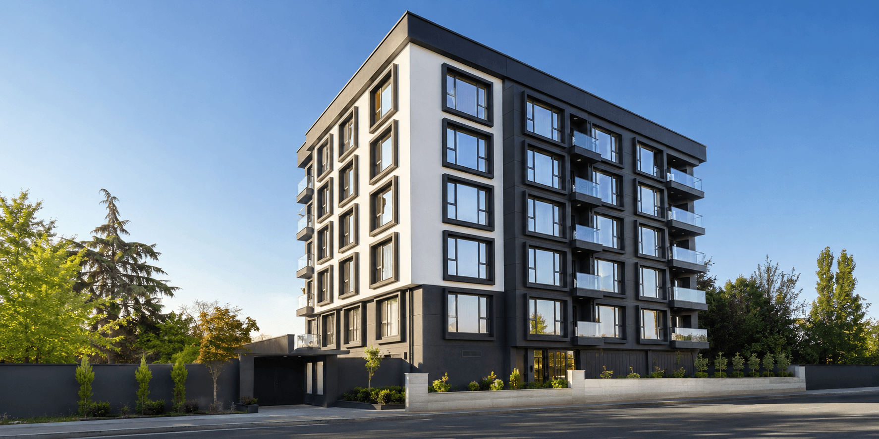 Astaş Kent Pendik konut binasının siyah-beyaz modern cepheli dış görünümü